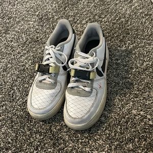 White and black Nikes with a hint of lime green